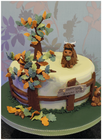 large highland cow autumn theme birthday cake